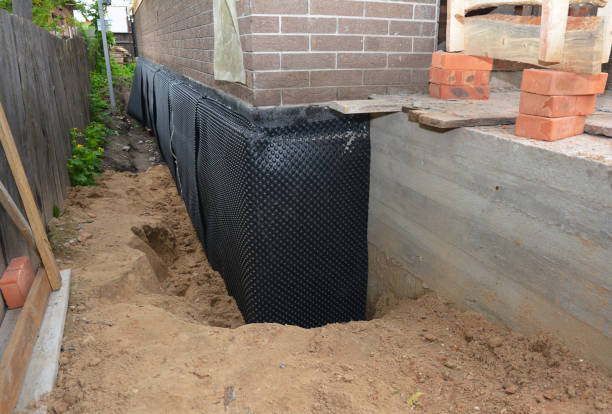 Happy homeowners after waterproofing job in Mount Cory